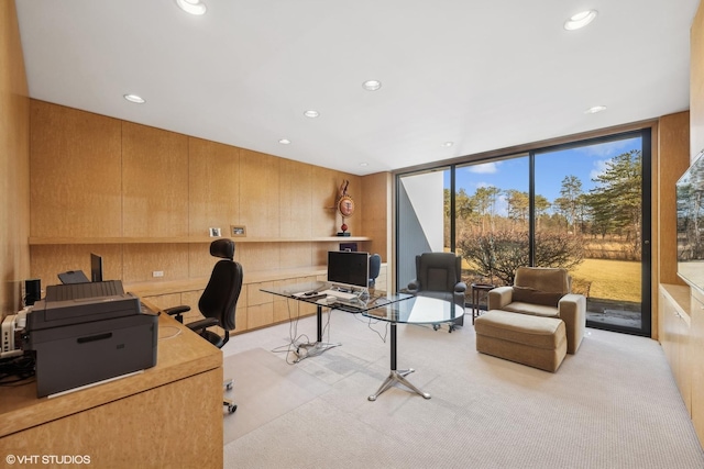 office featuring recessed lighting, light carpet, and floor to ceiling windows