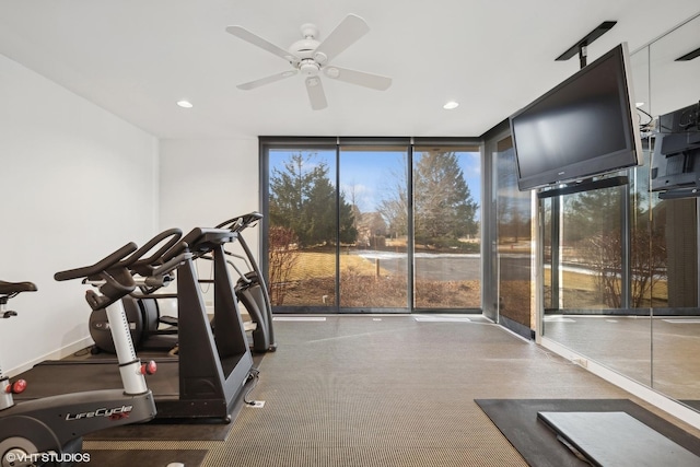 workout area with a ceiling fan, expansive windows, and recessed lighting
