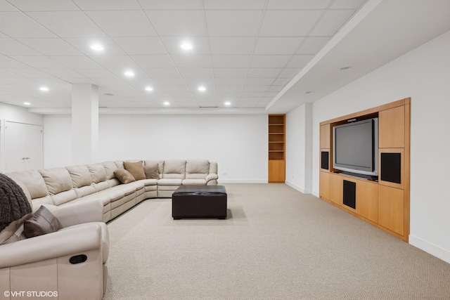 living room with light carpet, recessed lighting, and baseboards