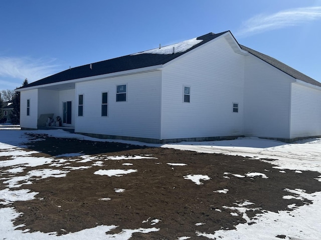 view of snow covered property