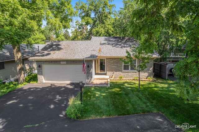 25W704 Jewell Rd, Wheaton, IL 60187 - ranch-style home featuring driveway, a garage, a front lawn, stone siding, and roof with shingles