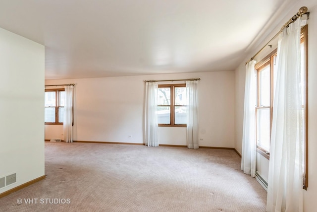 25W704 Jewell Rd, Wheaton, IL 60187 - spare room with carpet, plenty of natural light, and a baseboard radiator