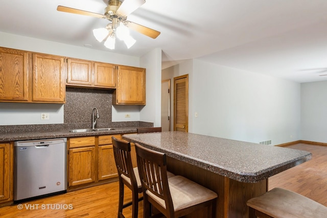 25W704 Jewell Rd, Wheaton, IL 60187 - kitchen featuring stainless steel dishwasher, a kitchen bar, and dark countertops