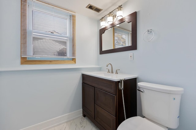 1165 Mayfield Ln, Hoffman Estates, IL 60169 - bathroom with vanity, baseboards, visible vents, toilet, and marble finish floor