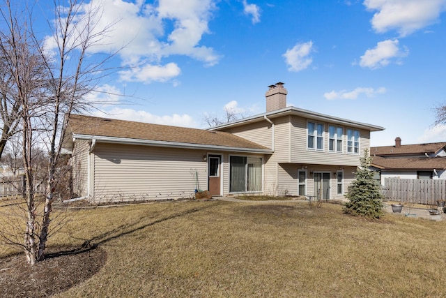 1165 Mayfield Ln, Hoffman Estates, IL 60169 - rear view of property featuring a yard, a chimney, and fence