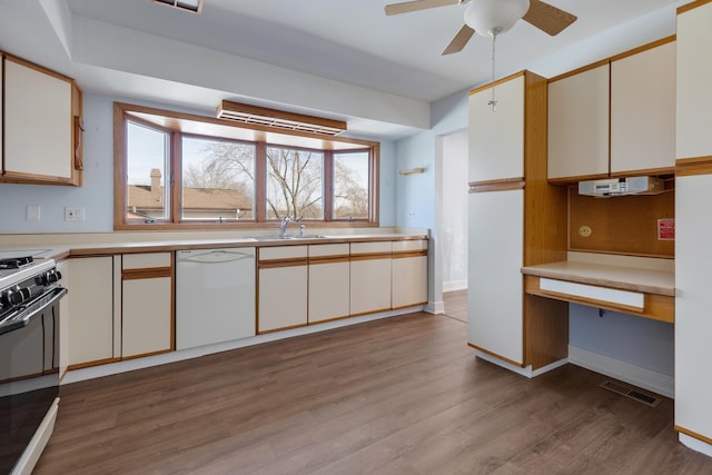 1165 Mayfield Ln, Hoffman Estates, IL 60169 - kitchen with visible vents, a sink, wood finished floors, gas range oven, and dishwasher