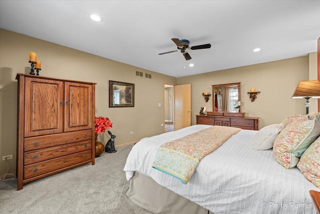 bedroom featuring light colored carpet, recessed lighting, baseboards, and visible vents