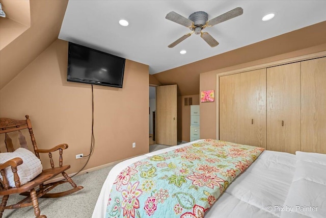 bedroom with carpet, a closet, recessed lighting, and lofted ceiling
