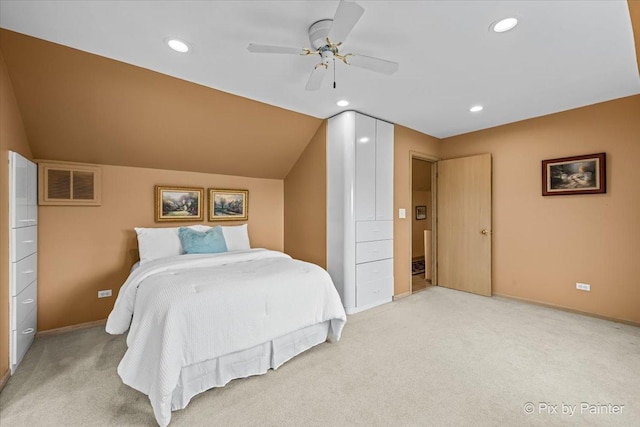 bedroom featuring light colored carpet, recessed lighting, lofted ceiling, and visible vents