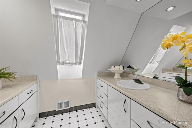 bathroom with visible vents, recessed lighting, tile patterned floors, and vanity