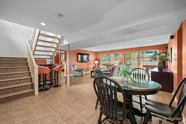 dining space featuring recessed lighting, baseboards, and stairway