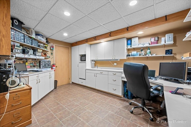 home office featuring light tile patterned floors, recessed lighting, and a paneled ceiling