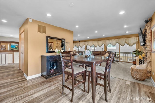 dining area featuring recessed lighting, baseboards, light wood-type flooring, and visible vents