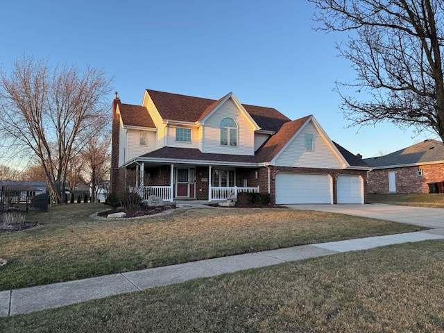 traditional home with brick siding, a front yard, covered porch, a chimney, and driveway