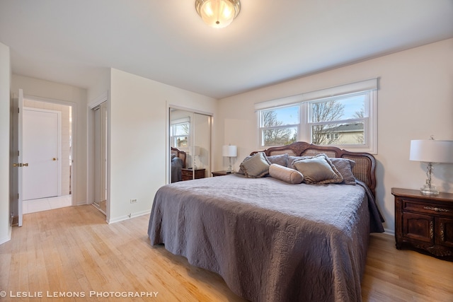 bedroom with baseboards and light wood-style flooring