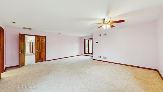 17N560 Hidden Hills Trl, Dundee, IL 60118 - spare room with visible vents, baseboards, a ceiling fan, and light carpet