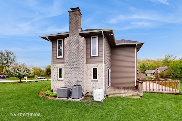 17N560 Hidden Hills Trl, Dundee, IL 60118 - back of house featuring a wooden deck, cooling unit, a chimney, and a lawn