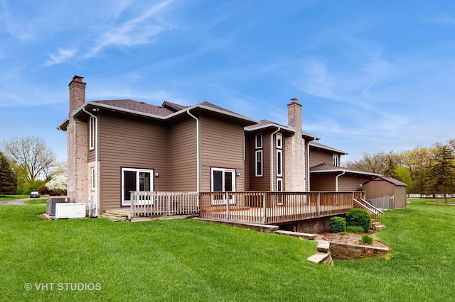 17N560 Hidden Hills Trl, Dundee, IL 60118 - rear view of property featuring a lawn, a chimney, and a wooden deck