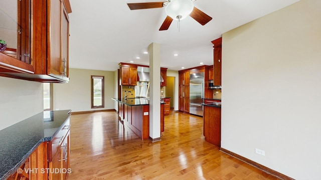 17N560 Hidden Hills Trl, Dundee, IL 60118 - kitchen with light wood-style flooring, a sink, wall chimney exhaust hood, high quality appliances, and backsplash