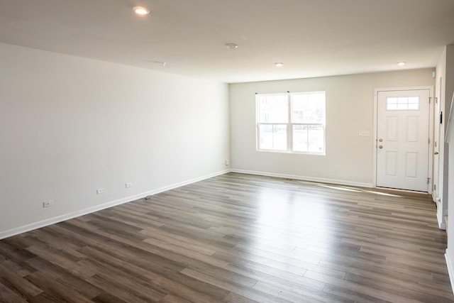 interior space featuring dark wood-style floors, recessed lighting, and baseboards