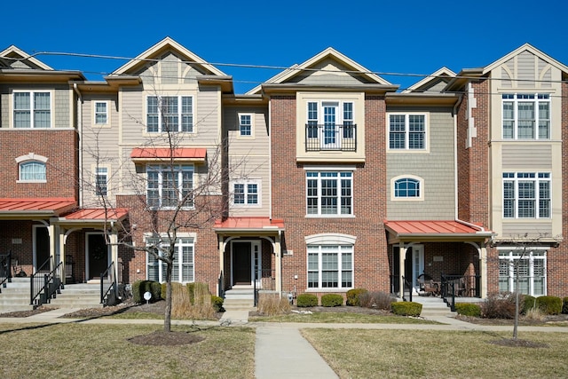 view of property with brick siding
