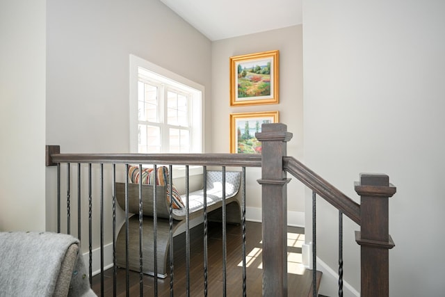 stairs with wood finished floors