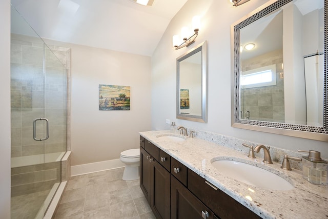 full bathroom with a sink, baseboards, a shower stall, and toilet