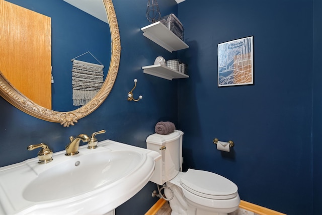 2S723 Timber Dr, Warrenville, IL 60555 - bathroom featuring toilet, baseboards, and a sink