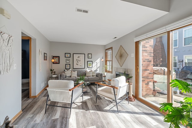 2S723 Timber Dr, Warrenville, IL 60555 - living room featuring visible vents, baseboards, and wood finished floors