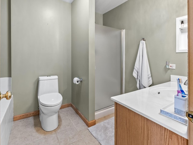 bathroom featuring tile patterned floors, a shower stall, toilet, vanity, and baseboards