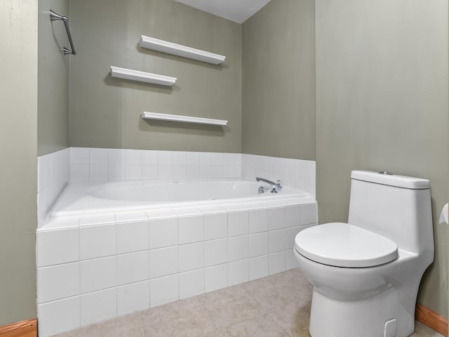 bathroom featuring toilet, a garden tub, and tile patterned floors