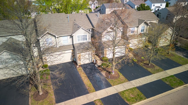 birds eye view of property with a residential view