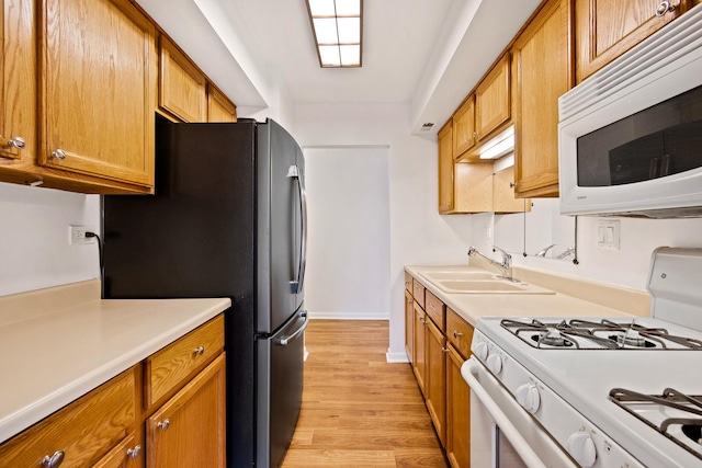 2275 Country Club Dr Unit 24, Woodridge, IL 60517 - kitchen with white appliances, light wood finished floors, light countertops, brown cabinetry, and baseboards