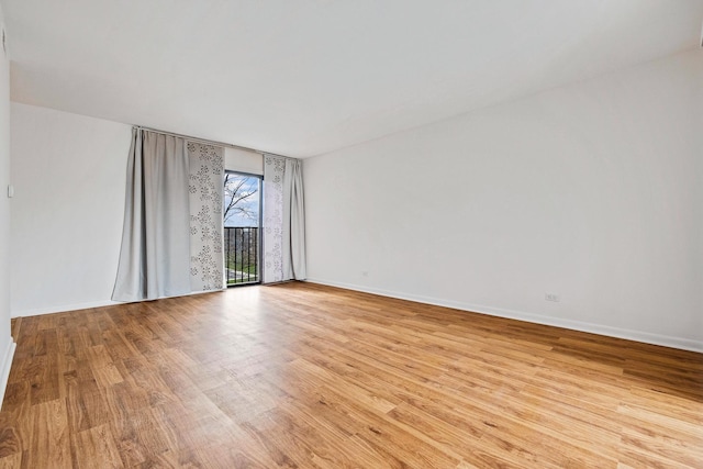 2275 Country Club Dr Unit 24, Woodridge, IL 60517 - empty room with light wood finished floors and baseboards