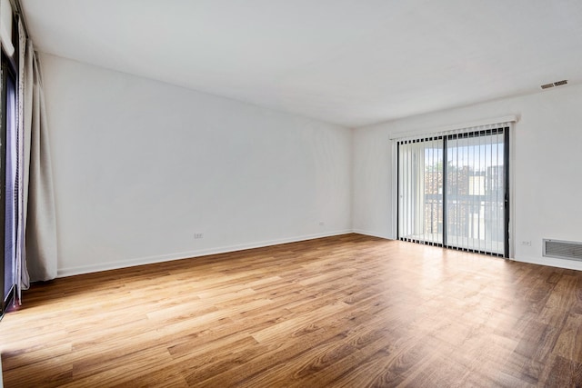 2275 Country Club Dr Unit 24, Woodridge, IL 60517 - spare room with wood finished floors and baseboards