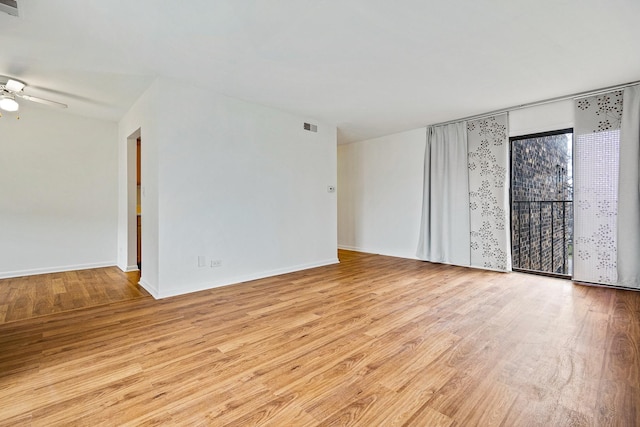2275 Country Club Dr Unit 24, Woodridge, IL 60517 - spare room featuring light wood finished floors and a ceiling fan