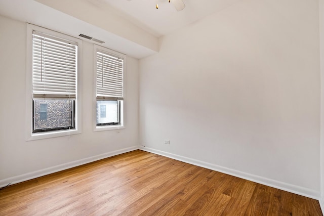 2275 Country Club Dr Unit 24, Woodridge, IL 60517 - spare room featuring light wood-style flooring, baseboards, and ceiling fan