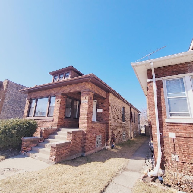 view of home's exterior with brick siding