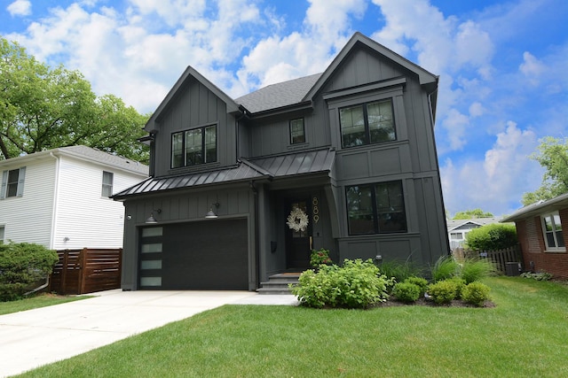 modern farmhouse with a garage, board and batten siding, and a standing seam roof