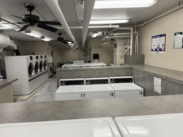 community laundry room featuring washer and dryer and ceiling fan