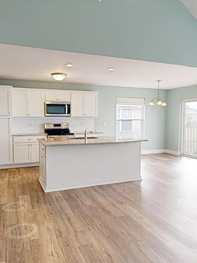 6156 Stone Pathway, Bourbonnais, IL 60914 - kitchen featuring a chandelier, appliances with stainless steel finishes, tasteful backsplash, and light wood-style floors