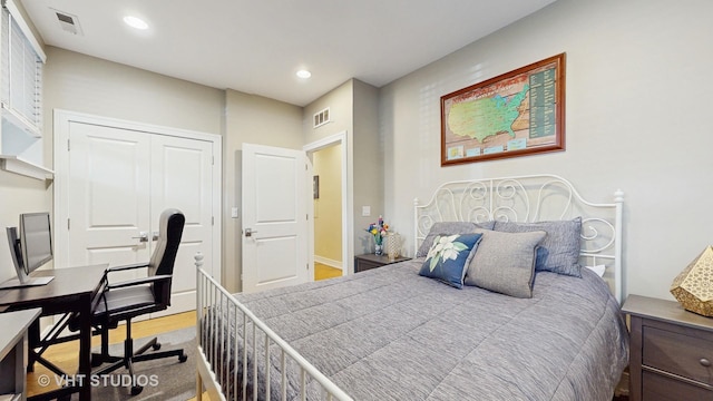 bedroom featuring a closet, recessed lighting, and visible vents