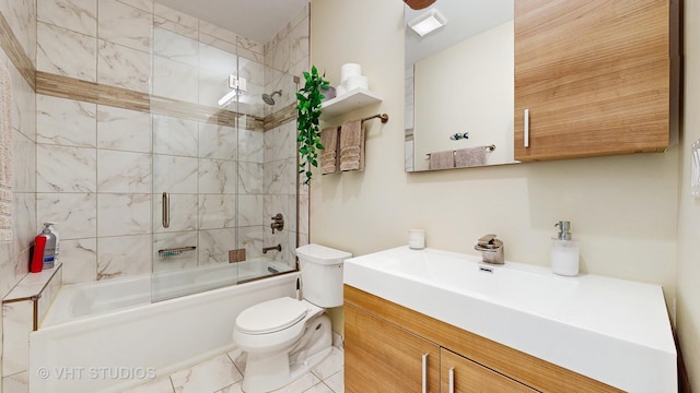 bathroom featuring vanity, bath / shower combo with glass door, visible vents, and toilet