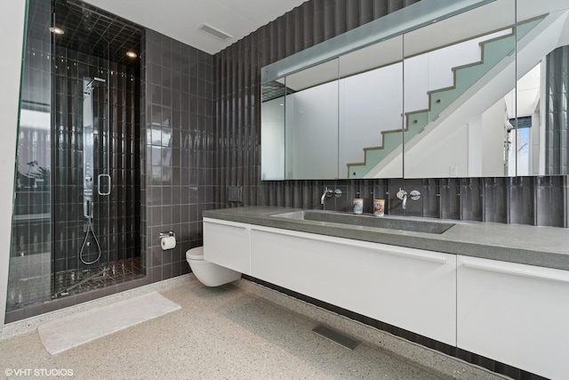 1825 W Wabansia Ave, Chicago, IL 60622 - full bathroom with speckled floor, a stall shower, toilet, vanity, and tile walls