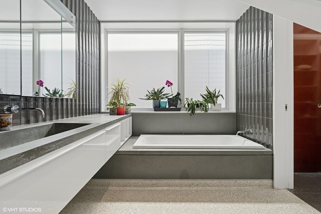 1825 W Wabansia Ave, Chicago, IL 60622 - bathroom with speckle patterned floor, a garden tub, vanity, and healthy amount of natural light