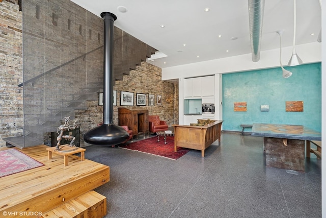 1825 W Wabansia Ave, Chicago, IL 60622 - living room featuring a wood stove and speckle patterned floor
