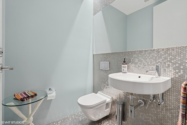 1825 W Wabansia Ave, Chicago, IL 60622 - half bath with tile patterned flooring, tile walls, toilet, and a sink
