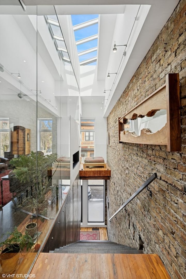 1825 W Wabansia Ave, Chicago, IL 60622 - stairway featuring wood-type flooring, healthy amount of natural light, and a skylight