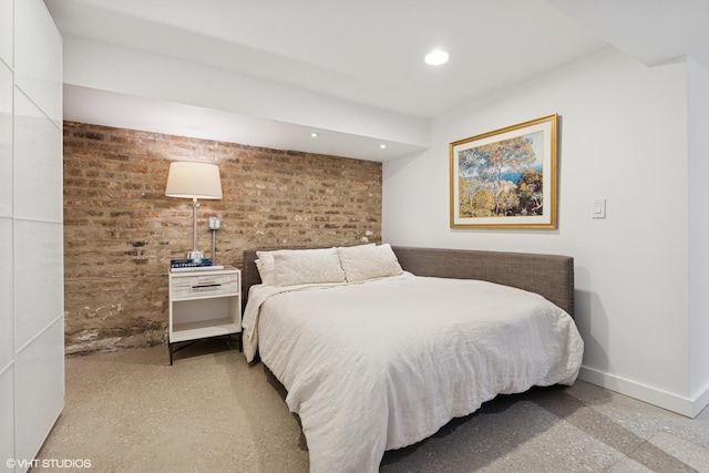 1825 W Wabansia Ave, Chicago, IL 60622 - bedroom featuring brick wall, recessed lighting, baseboards, and speckle patterned floor