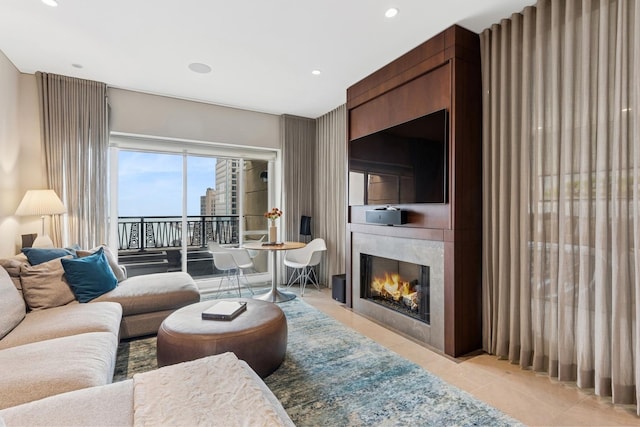 living room with light tile patterned floors, a large fireplace, and recessed lighting